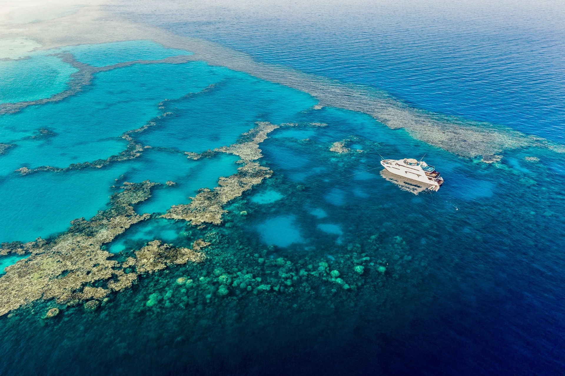 Aerial view of Sataya Reef with the yacht anchored beside it